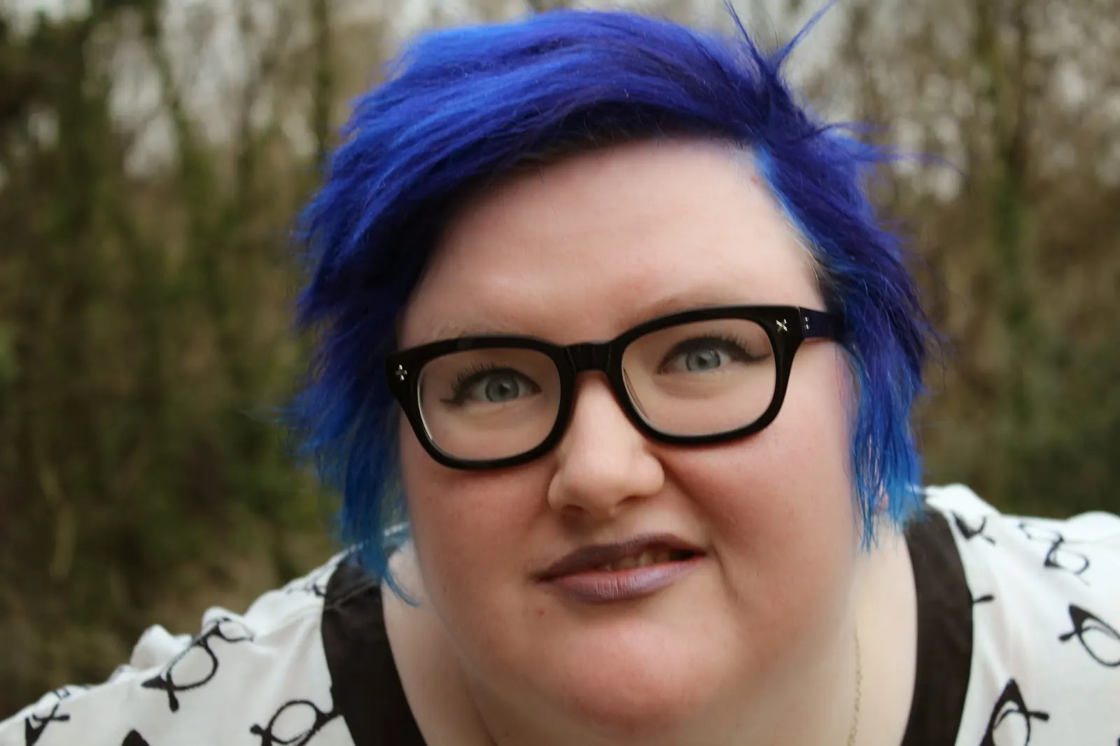 A feminist who has defiled her glory by cutting her hair and dyeing it blue